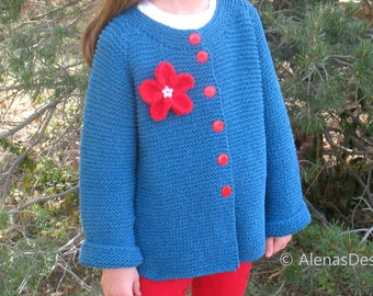 May include: A blue knitted cardigan with red buttons and a red flower embellishment. The cardigan has long sleeves and a round neckline.