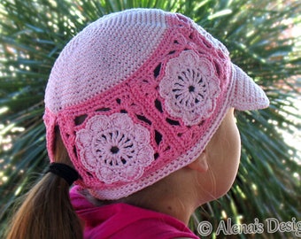 May include: A pink crocheted hat with a flower design and a visor. The hat has a ponytail hole in the back.  "Alena's Design" is written in the bottom right corner of the image.