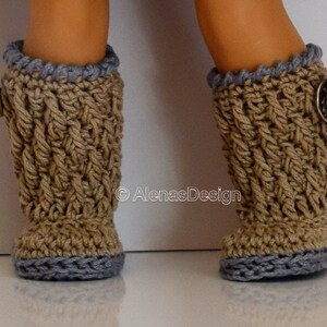 May include: A pair of brown crocheted boots with gray trim and a silver button on each boot.