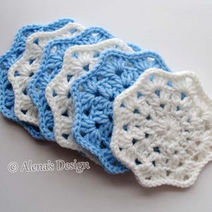 May include: A stack of six crocheted star-shaped coasters in alternating blue and white colors. The coasters are made with a delicate, lacy stitch pattern.