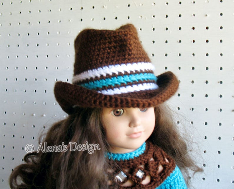 May include: A brown crocheted cowboy hat with white and turquoise stripes. The hat is worn by a doll with long brown hair.