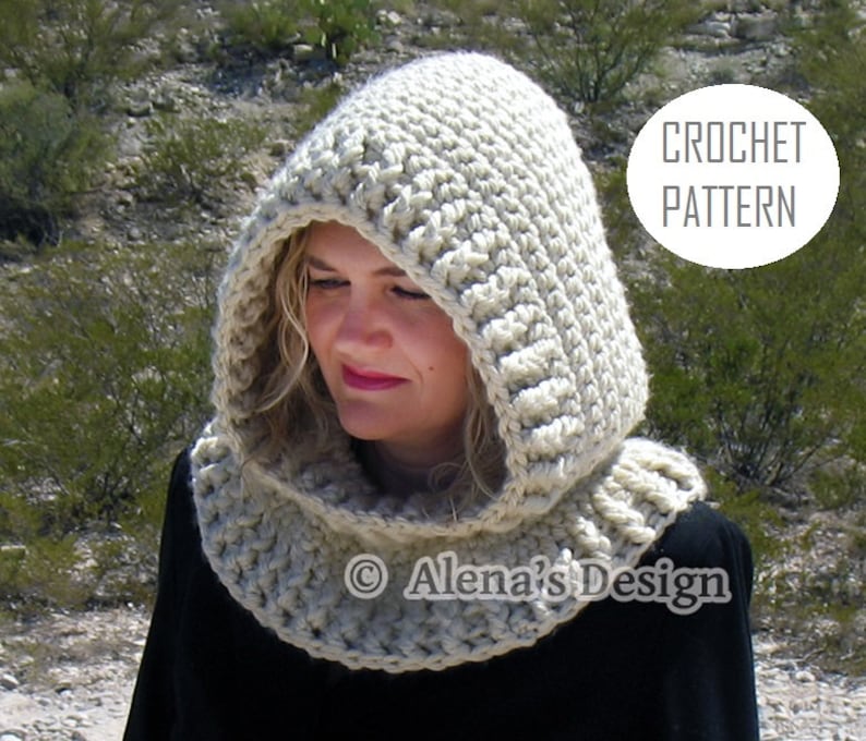 May include: A beige crochet hood and cowl set. The hood is thick and textured, with a rounded shape that frames the face. The cowl is a matching color and texture, designed to be worn around the neck. The words "CROCHET PATTERN" are in a white circle.