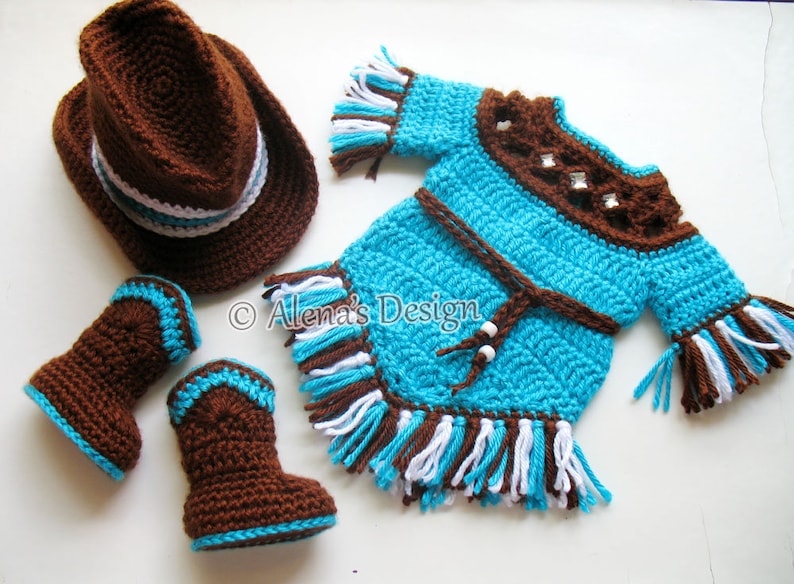 May include: A crocheted baby outfit in brown, turquoise, and white. The outfit includes a hat, dress, and booties. The dress has fringe trim and a brown belt. The hat has a white band.