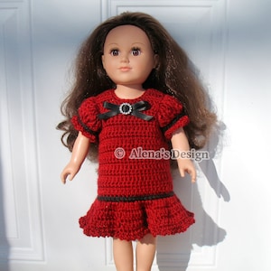 May include: A red crochet dress with black trim and a black bow with a rhinestone embellishment. The dress is worn by a doll with brown hair.