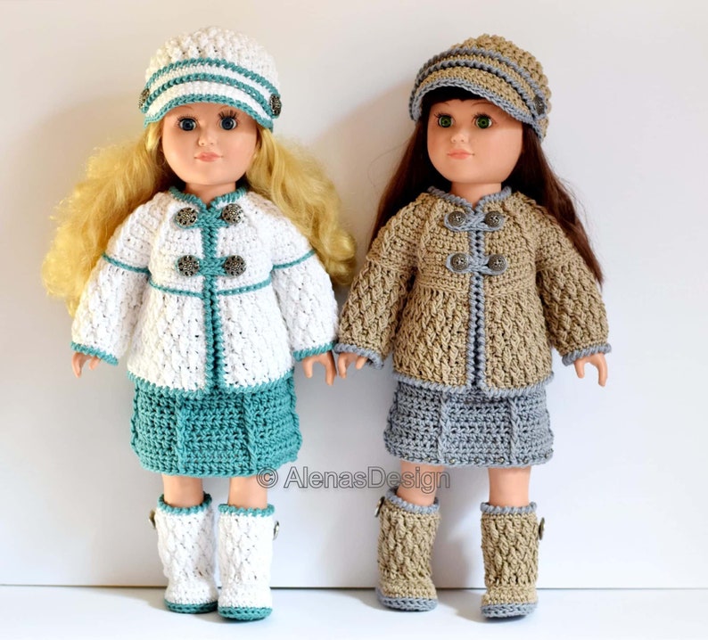 May include: Two dolls wearing crocheted outfits. The doll on the left is wearing a white crocheted jacket with teal buttons, a teal skirt, and white crocheted boots. The doll on the right is wearing a tan crocheted jacket with teal buttons, a gray skirt, and tan crocheted boots. Both dolls are wearing crocheted hats.