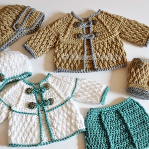 May include: A set of crocheted baby clothes in white, tan, and teal. The set includes a hat, jacket, skirt, and booties. The jacket has buttons and a teal trim. The skirt is teal and the booties are tan with a gray trim. The hat is white with a teal trim and a button.