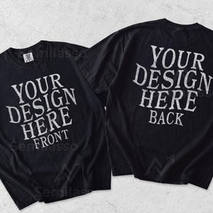 May include: Two black short-sleeve t-shirts displayed side by side. The left shirt features white text reading YOUR DESIGN HERE FRONT. The right shirt features white text reading YOUR DESIGN HERE BACK. Both shirts have a crew neckline and short sleeves.