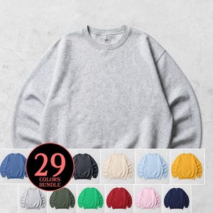 May include: A grey crew neck sweatshirt. The image displays a selection of colours available in a bundle, including blue, black, beige, light blue, and yellow. The text "29 COLORS BUNDLE" is shown in a circular graphic.
