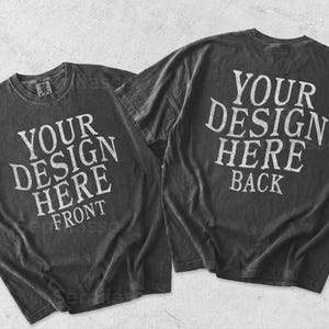 May include: Two charcoal gray short-sleeve t-shirts displayed flat. The left shirt features the white text YOUR DESIGN HERE FRONT. The right shirt features the white text YOUR DESIGN HERE BACK. Both shirts have a crew neckline and a vintage wash finish.