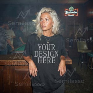 May include: A white ceramic mug with a black handle and the text "But First, Coffee" in a handwritten style. The mug is on a white surface. The mug is approximately 4 inches tall.