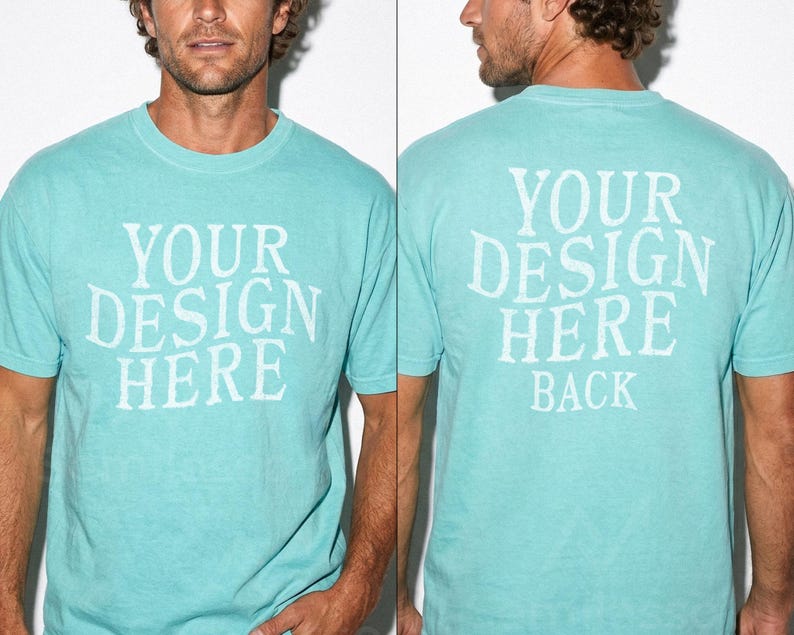 May include: A light turquoise t-shirt with the text "YOUR DESIGN HERE" printed on the front and "YOUR DESIGN HERE BACK" on the back. The shirt is a crew neck style and appears to be made of a soft material.