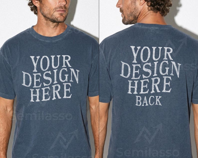 May include: A faded navy blue t-shirt with the text "YOUR DESIGN HERE" printed on the front and back. The back of the shirt also includes the word "BACK" below the main text. The shirt has short sleeves.