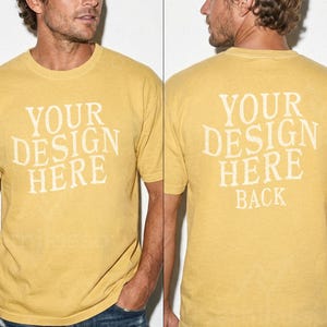 May include: Mustard yellow t-shirt with the text "YOUR DESIGN HERE" printed on the front and "YOUR DESIGN HERE BACK" on the back. The shirt is a short-sleeved crew neck style.