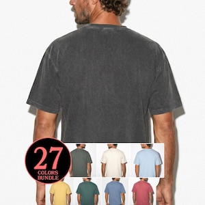 May include: A charcoal grey, short-sleeved t-shirt with a washed-out appearance. The image shows a person wearing the shirt, with a colour bundle graphic featuring 27 colour options. The shirt has a traditional crew neck.
