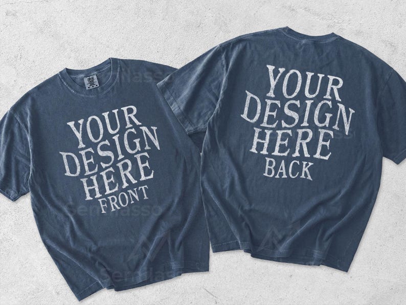 May include: Two dark blue t-shirts displayed together. The left shirt features the white text "YOUR DESIGN HERE FRONT" and the right shirt features the white text "YOUR DESIGN HERE BACK" in a distressed, weathered font style on the fabric.
