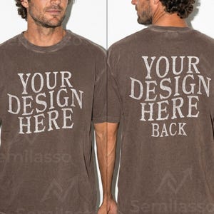 May include: Brown t-shirt with the text "YOUR DESIGN HERE" on the front and "YOUR DESIGN HERE BACK" on the back. The shirt has a crew neck and short sleeves. The fabric has a slightly faded appearance.