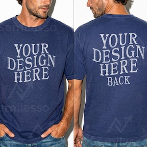 May include: Navy blue t-shirt with the text "YOUR DESIGN HERE" on the front and "YOUR DESIGN HERE BACK" on the back. The shirt is a crew neck style and has short sleeves. The shirt is worn by a person.