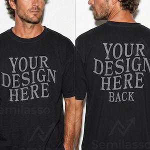 May include: Black crew neck t-shirt with the text "YOUR DESIGN HERE" on the front and "YOUR DESIGN HERE BACK" on the back in a distressed gray font. The shirt has a vintage look.