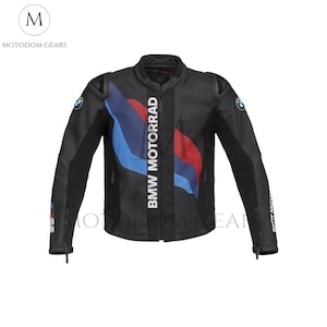 May include: Black motorcycle jacket with the BMW MOTORRAD logo in white. The jacket features blue and red accents on the front and BMW logos on the sleeves. The jacket has a zip closure and a stand-up collar.