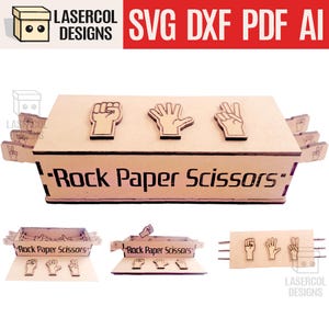 May include: A wooden Rock Paper Scissors game box with laser-cut hand gestures. The box features the text "Rock Paper Scissors" and includes separate game pieces. The top of the box displays the rock, paper, and scissors symbols.