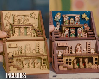 May include: A two-storey wooden nativity scene display featuring laser-cut figures of the holy family, wise men, angels, and animals. The structure includes stairs, ladders, and fences. Text reads LASERCOL DESIGNS x Innovarte, INCLUDES ENGLISH VERSION, SVG DXF PDF AI.