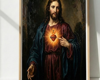 Puede incluir: Obra de arte religiosa enmarcada que representa a un hombre con cabello largo castaño y barba, vistiendo una túnica roja y una capa azul. Un corazón brillante con una cruz es visible en su pecho. La obra está en un marco de madera.