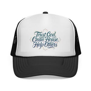 May include: A black and white trucker hat with a curved peak. The white front panel displays the text "Trust God, Clean House, Help Others" in teal and navy blue script. The hat has a mesh back.