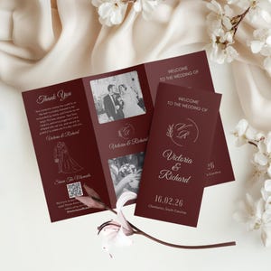 May include: Burgundy wedding stationery set, including a tri-fold invitation and two smaller cards. The main invitation has photos, text, and a QR code. The smaller cards read "Welcome to the Wedding of Victoria & Richard".