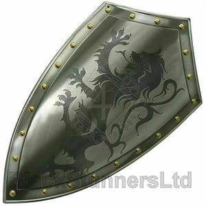 May include: A silver-coloured shield featuring a black lion emblem. The shield has a curved shape with a border of gold-coloured rivets. The shield has the text "BlackStannersLtd" at the bottom.