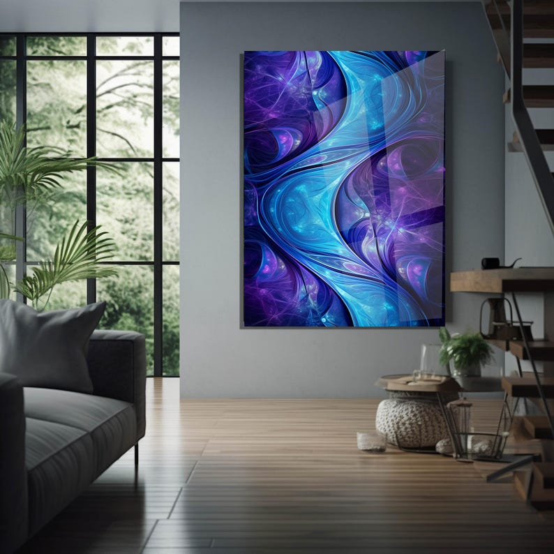 May include: Abstract art print with a flowing design in shades of blue and purple. The artwork is displayed on a wall in a modern living room setting, with natural light and wooden floors.