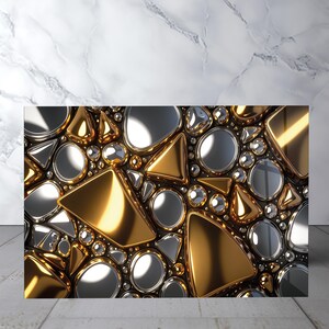 May include: A decorative wall panel featuring a dense arrangement of polished gold and silver geometric shapes, including triangles, circles, and irregular pebble-like forms, creating a high-gloss, reflective, and three-dimensional mosaic surface.