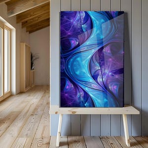 May include: Abstract art print with a dynamic design in blue and purple hues. The artwork presents flowing, organic forms with detailed elements, creating a visually engaging composition. The print is displayed on a wooden bench against a grey wall.