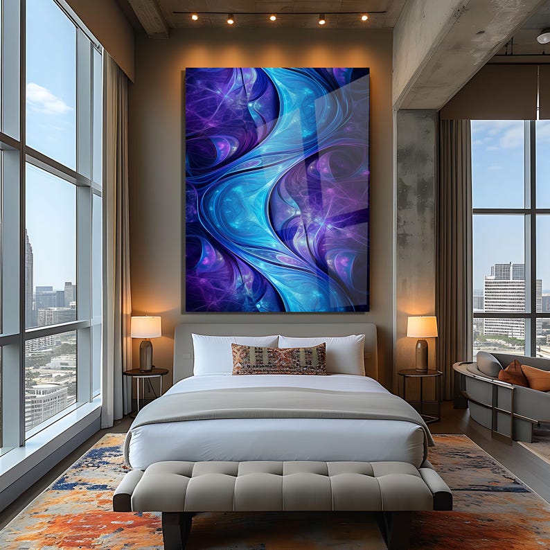 May include: An abstract artwork in shades of blue and purple, with flowing shapes, hangs above a bed in a modern bedroom. The room features large windows with city views, creating a contemporary and stylish interior.