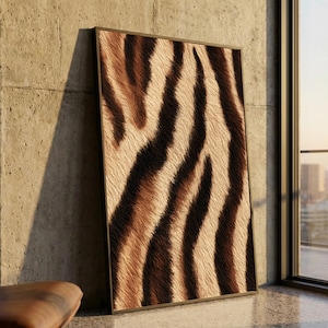 May include: A rectangular wall art piece featuring a high-resolution print of a textured animal fur pattern with alternating dark brown and cream-coloured stripes. The artwork is encased in a thin, dark-coloured frame and stands upright.