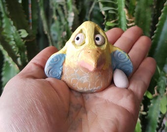 Handmade ceramic bird figurine with egg — small art sculpture