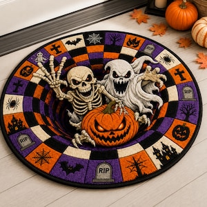 May include: A round doormat featuring a 3D-style optical illusion of a black hole. The design includes a skeleton, a white ghost, and a jack-o'-lantern. The border has a checkered pattern in orange, purple, and black with icons of bats, spiders, and tombstones.