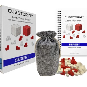 May include: A Cubetoria Series 1 puzzle set with a white box, a spiral-bound booklet, a drawstring bag, and polycube pieces. The box and booklet feature the Cubetoria logo and text. The set includes 47 polycube pieces in red and white.