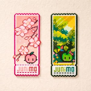 May include: A white ceramic mug with a black handle and the text "But first, coffee" in a handwritten style. The mug is on a white surface. The mug is approximately 10 cm tall.