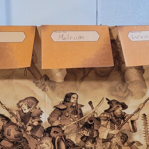 May include: Three tan name tags labelled "Poppy", "Melrum", and "Wonk" are placed above a fantasy illustration. The illustration depicts a battle scene with various characters, weapons, and creatures.