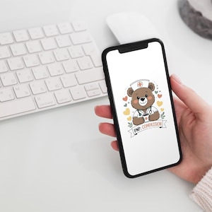 May include: A smartphone screen shows a cartoon bear in a nurse's uniform, with a white hat and stethoscope, holding a coffee cup. The bear is surrounded by hearts and a banner reads "PNP: Compassion".