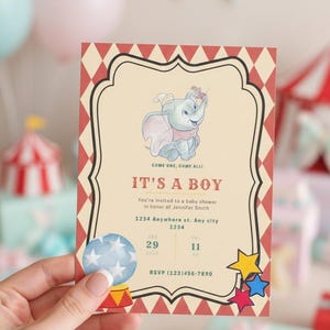 May include: A baby shower invitation with a circus theme. The invitation features an illustration of Dumbo the elephant, the text "IT'S A BOY", and event details. The invitation is held by a hand.