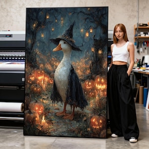 May include: A large rectangular framed print featuring a white duck wearing a black witch hat and a dark tattered cape. The duck stands in a dark forest filled with glowing orange jack-o'-lanterns and hanging lanterns suspended from twisted tree branches.