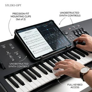 May include: A white ceramic mug with a black handle and the text "But First, Coffee" in a black, handwritten-style font. The mug is on a white surface.