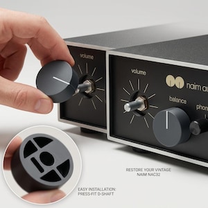 May include: A dark grey circular volume control knob for a Naim NAC32 audio device. The knob features a white indicator line and a press-fit D-shaft interior. Text on the image includes "RESTORE YOUR VINTAGE NAIM NAC32" and "EASY INSTALLATION: PRESS-FIT D-SHAFT".