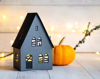 Haunted farmhouse paper luminary, complete with bat and black cat details, handmade Halloween decoration that folds completely flat to store