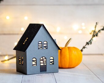 Haunted Halloween paper house luminary, with black cat and bat details, folds perfectly flat to store