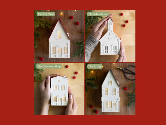 Village Square Luminary Set - Christmas village bakery, toy shop, schoolhouse and chocolate shop, all made of layered paper, folds flat