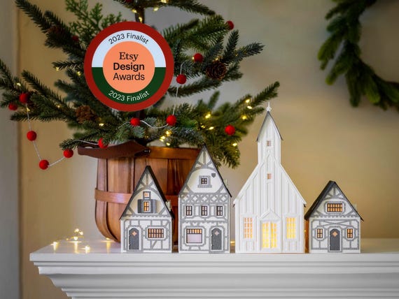 ETSY DESIGN AWARDS finalist - Half-Timbered Layered Paper Christmas Village. Folds perfectly flat to store.