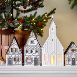 ETSY DESIGN AWARDS finalist 2023: Half-Timbered Layered Paper Christmas Village - folds perfectly flat to store