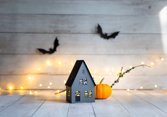 Haunted farmhouse paper luminary, complete with bat and black cat details, handmade Halloween decoration that folds completely flat to store